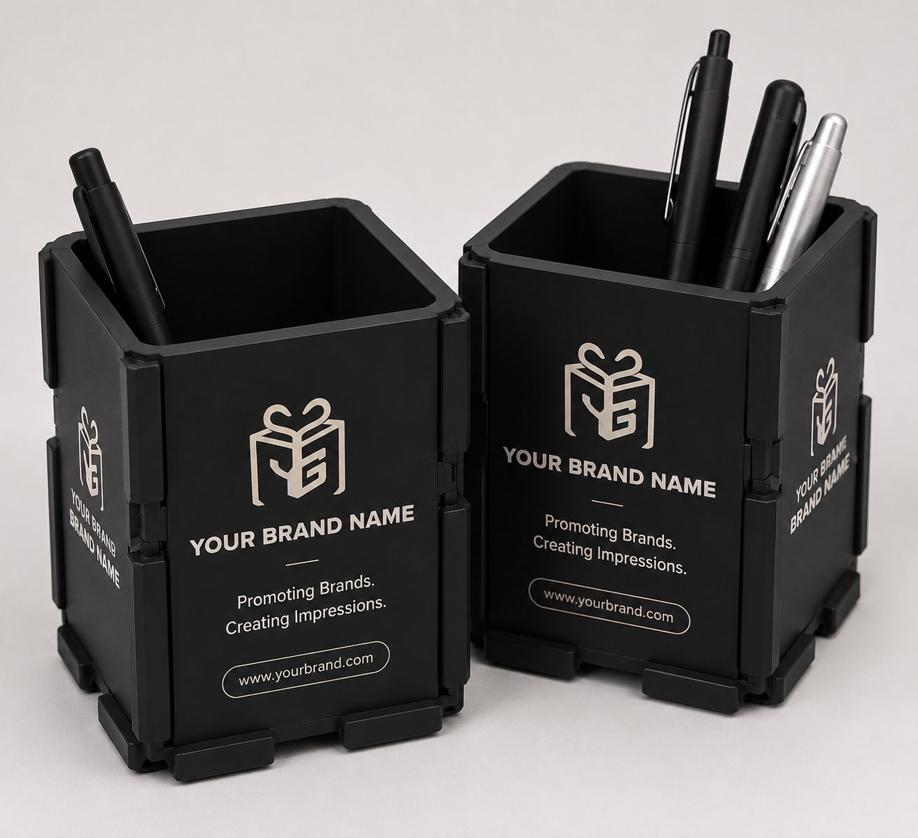 Black moulded pen stands branded on all four faces